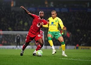 Images Dated 14th March 2011: Battling for Control: Cisse vs. Jackson in the Intense Championship Clash between Norwich City
