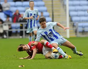 Coventry City V Bristol City Prints: Battling for Control: Freeman vs. Miller in Sky Bet League One Clash