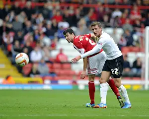 Battling for Control: Moloney vs. Gilbey - Intense Rivalry in Bristol City vs. Colchester United Football Match