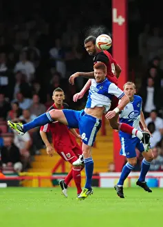 Louis Carey Testimonial Prints: Battling for Height: A Football Rivalry - Liam Fontaine vs