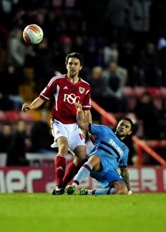 Images Dated 17th April 2012: Battling Midfielders: Skuse vs. Lansbury at Ashton Gate, 2012 - A Football Rivalry Unfolds