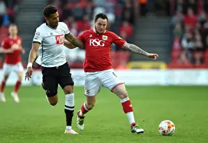 Bristol City V Derby County Prints: Battling Rivals: Lee Tomlin vs Cyrus Christie in the 2016 Championship Clash (Bristol City v Derby County)