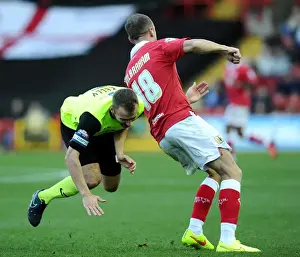 Bristol City V Oldham Prints: Battling Rivals: Wilbraham vs. Kelly - Intense Moment at Ashton Gate
