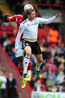 Images Dated 31st March 2012: Battling for Supremacy: Andre Amougou vs. Steve Davies in the Derby County vs. Bristol City Clash