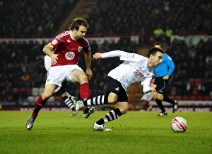 Images Dated 1st February 2011: Battling for Supremacy: Brett Pitman vs. Leon Britton in the 2011 Championship Clash between