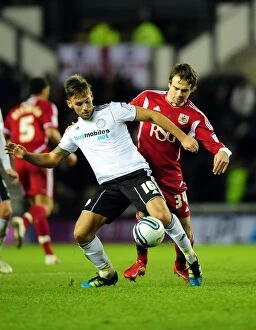 Images Dated 10th December 2011: Battling for Supremacy: Brett Pitman vs. James Bailey in Derby County vs