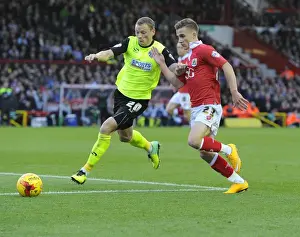Battling for Supremacy: Bryan vs. Wilson in Bristol City vs. Oldham Athletic Football Match, November 2014