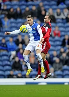 Images Dated 5th January 2013: Battling for Supremacy: Carey vs. Rochina in FA Cup Clash between Blackburn and Bristol City