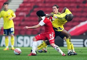 Images Dated 24th March 2012: Battling for Supremacy: Cisse vs. Zemmama in the Heat of Middlesbrough vs. Bristol City Rivalry