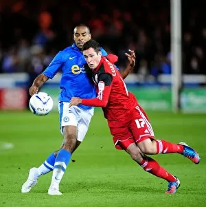 Images Dated 18th September 2012: Battling for Supremacy: Cunningham vs Barnett in Peterborough United vs Bristol City Championship