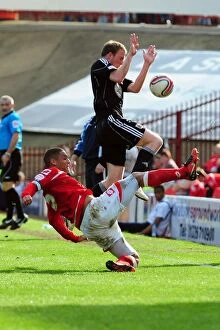 Images Dated 9th April 2011: Battling for Supremacy: Doyle vs. Clarkson in the Championship Clash between Barnsley