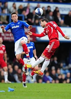 Images Dated 17th March 2012: Battling for Supremacy: Foster vs. Allan in Portsmouth vs. Bristol City Clash