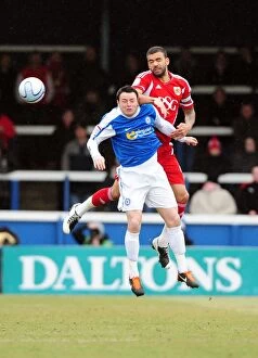 Images Dated 18th February 2012: Battling for Supremacy: Liam Fontaine vs. Lee Tomlin in Peterborough United vs