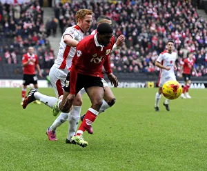 Battling for Supremacy: Mark Little vs. Dean Lewington in MK Dons vs. Bristol City Football Clash
