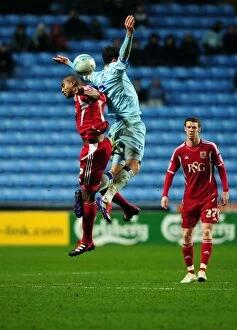 Images Dated 26th December 2011: Battling for Supremacy: Marvin Elliott vs. Richard Keogh in Coventry City vs