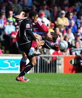 Images Dated 17th April 2010: Battling for Supremacy: Maynard vs. Milne in the Championship Clash between Scunthorpe