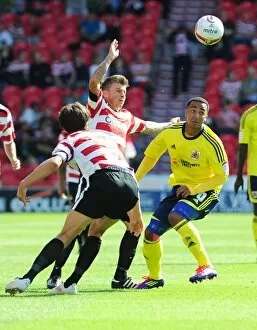 Images Dated 27th August 2011: Battling for Supremacy: Maynard vs. Oster in Doncaster Rovers vs. Bristol City (League Cup, 2011)