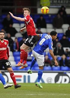 Images Dated 8th February 2014: Battling for Supremacy: Wade Elliott vs. Korey Smith in Oldham Athletic vs
