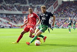 Images Dated 22nd August 2015: Battling for Supremacy: Wes Burns vs Emilio Nsue in Middlesbrough vs Bristol City Championship Clash