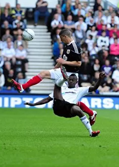 Images Dated 30th April 2011: Battling for Supremacy: Wilson vs. Robinson in the Derby County vs