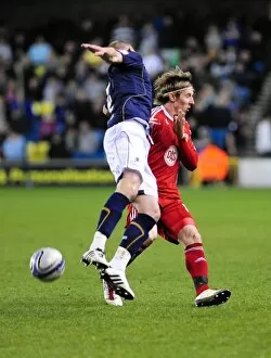 Images Dated 12th April 2011: Battling for Supremacy: Woolford vs. Dunne in the Championship Clash between Millwall