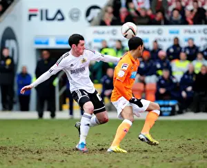 Black Pool Prints: Blackpool's Thomas Ince Evades Bristol City's Gregg Cunningham During Npower Championship Clash