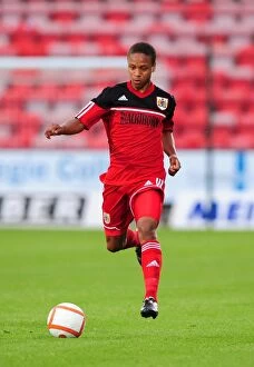 Images Dated 1st August 2012: Bobby Reid in Action: Bristol City's Star Player Shines in Pre-Season Friendly Against Dunfermline