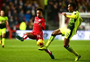 Bristol City V Reading Prints: Bobby Reid Closes In: A Tight Battle Between Bristol City's Reid and Reading's Obita at Ashton Gate
