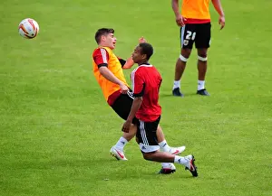 Training Prints: Bobby Reid Soars Over Joe Edwards: A Moment from Bristol City's Pre-Season Training
