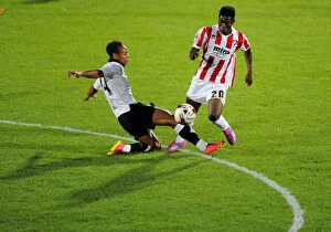 Images Dated 29th July 2014: Bobby Reid Tackles Koby Arthur in Pre-Season Clash between Cheltenham Town and Bristol City