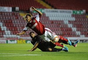 Images Dated 24th July 2013: Bobby Reid vs Adrian Mariappa: Intense Penalty Box Clash in Bristol City vs Reading Football Match