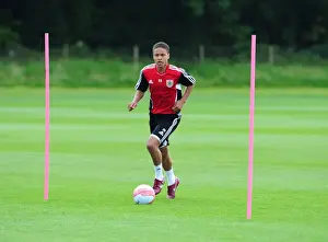 Pre-season Training Prints: Bobby Reid's Unwavering Determination: Braving the Elements in Bristol City's Pre-Season Training