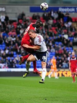 Images Dated 20th October 2012: Bolton's Warnock Fouls Albert Adomah of Bristol City - Championship Clash, 2012