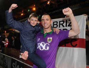 Images Dated 14th April 2015: Bradford City vs. Bristol City: Aaron Wilbraham Celebrates Promotion-Winning Goal with Young Fan