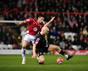 Bristol City V Barnsley Prints: Bradley Orr vs. Emil Hallfredsson: Intense Battle for the Ball in Bristol City vs
