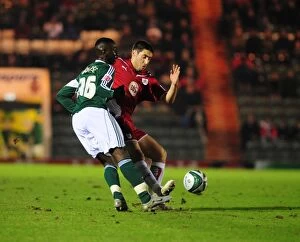 Images Dated 16th March 2010: Bradley Orr vs Yannick Bolasie: Intense Battle in the Championship Clash between Plymouth Argyle