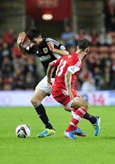 Images Dated 24th September 2013: Brendan Moloney vs. Danny Fox: Intense Moment at St. Mary's Stadium - Southampton vs