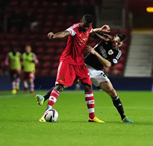 Framed Print : Brendan Moloney vs Guilherme do Prado: Intense Clash in Southampton vs Bristol City Football Match, 2013