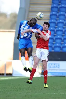 Colchester United V Bristol City Prints: Brendan Moloney vs Jabo Ibehre: Aerial Battle in Colchester United vs Bristol City Football Match