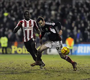 Brentford V Bristol City Prints: Brentford's Clayton Donaldson Stops Greg Cunningham of Bristol City, January 2014