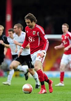 Images Dated 31st March 2012: Brett Pitman of Bristol City Faces Off Against Derby County at Ashton Gate Stadium, 2012