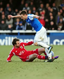 Brett Pitman of Bristol City Tackles Lee Frecklington of Peterborough United during the Football Match