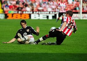Images Dated 23rd April 2011: Brett Pitman vs. Shane Duffy: Intense Clash Between Sheffield United and Bristol City Footballers