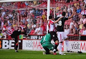 Images Dated 23rd April 2011: Brett Pitman's Fortuitous Corner: Own Goal by Steve Simonsen Shifts Championship Match in Favor of
