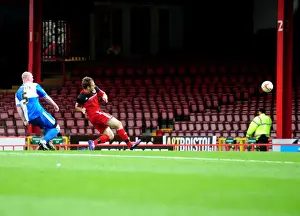 Louis Carey Testimonial Prints: Brett Pitman's Thunderous Shot Hits the Bar: A Moment from the Louis Carey Testimonial