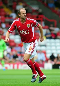 Season 11-12 Prints: Bristol City Captain Louis Carey Leads the Charge Against West Brom in Championship Clash at Ashton Gate