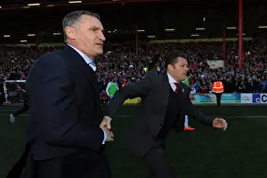 Title Prints: Bristol City Claims League Victory: Cotterill and Mowbray Share a Handshake Amidst Fans Euphoria