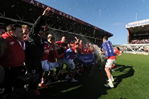 Title Prints: Bristol City Crowned Champions: Aden Flint and Teammates Celebrate with Champagne