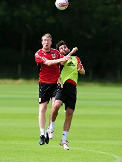Images Dated 6th July 2010: Bristol City: David Clarkson vs. Paul Hartley - Aerial Battle in Pre-Season Training