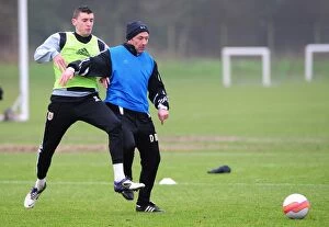 Training 10-1-12 Collection: Bristol City: Derek McInnes and James Wilson Clash in Intense Training Session